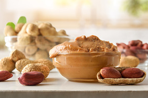 Detail of bowl filled with peanut butter on kitchen bench, a Food & Drink Photo by Davizro's Market