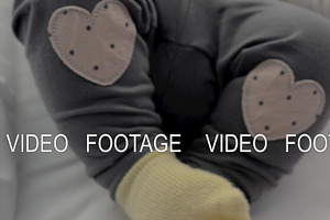 Active baby girl in yellow socks and