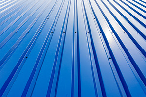 Close-up of blue corrugated metal wall with sunlight reflection,, a Background Photo by Ales Munt