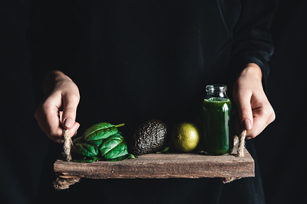 Girl holds a smoothie with spinach featuring background, food, and vintage
