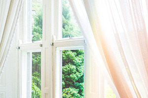 Window with curtains containing window, curtains, and antic