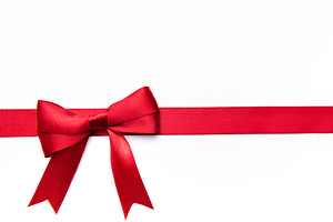 Red satin ribbon bow on white background, a Holiday Photo by Olena Rudo