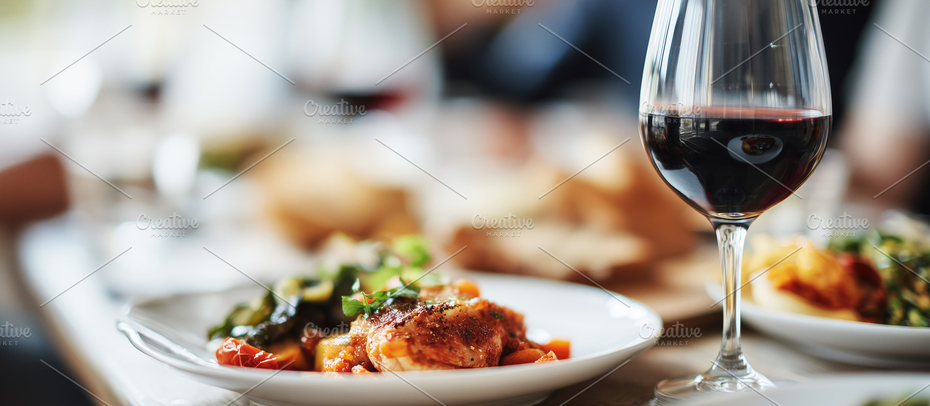 Glass of red wine served with, a Food & Drink Photo by MistyDay
