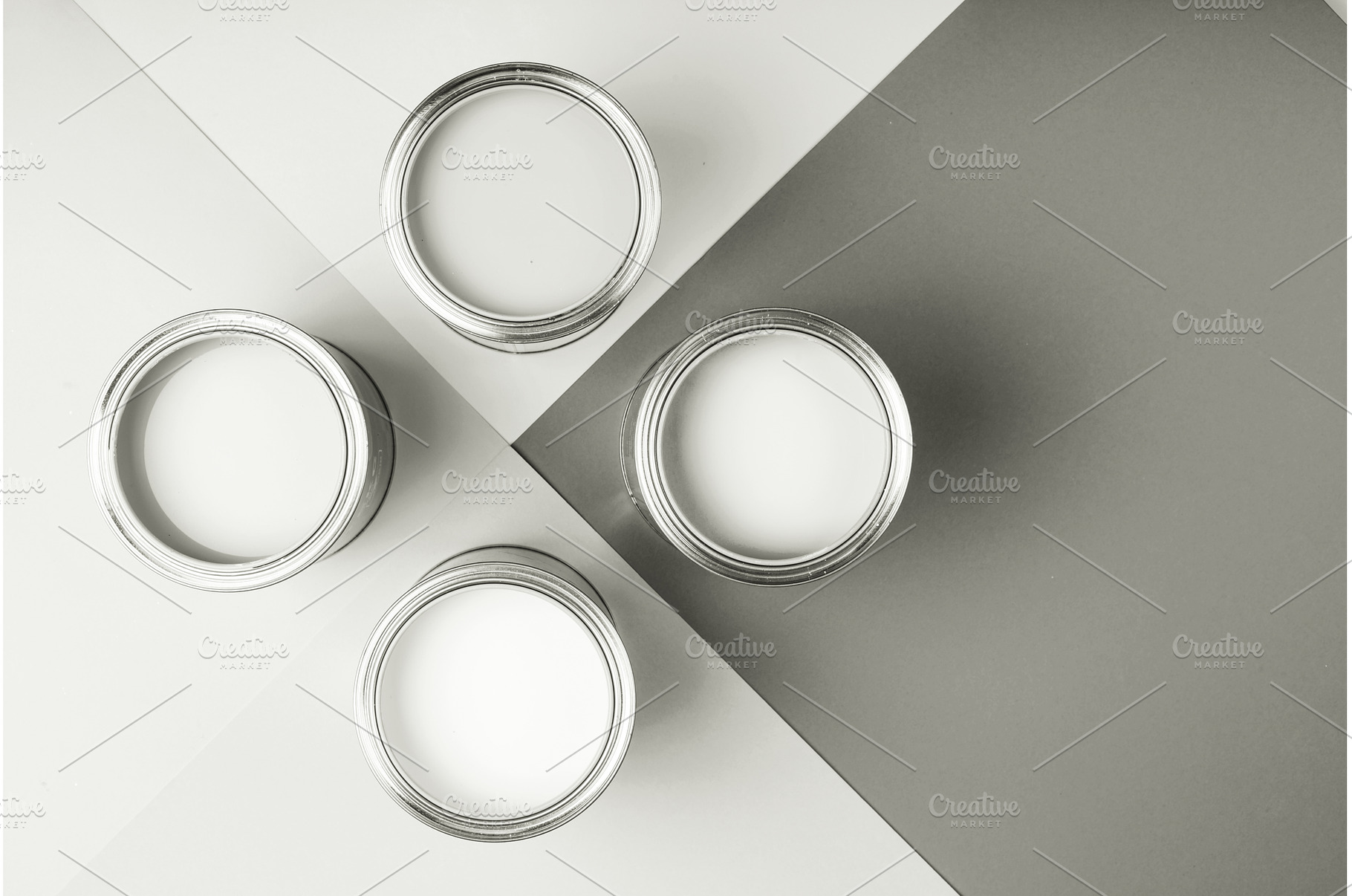 White paint cans on a gray geometric, a Background Photo by Anna Efetova