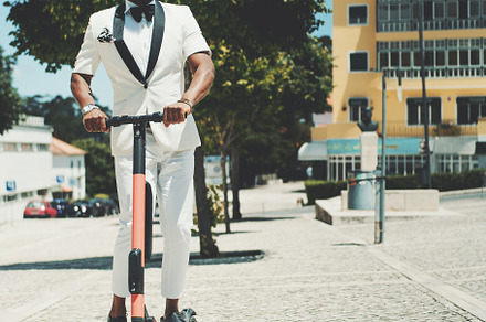 Fancy African man with an e-scooter, a Person Photo by SkyNext
