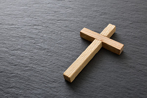 Wooden Cross on Dark Stone Background, a Holiday Photo by Davizro's Market