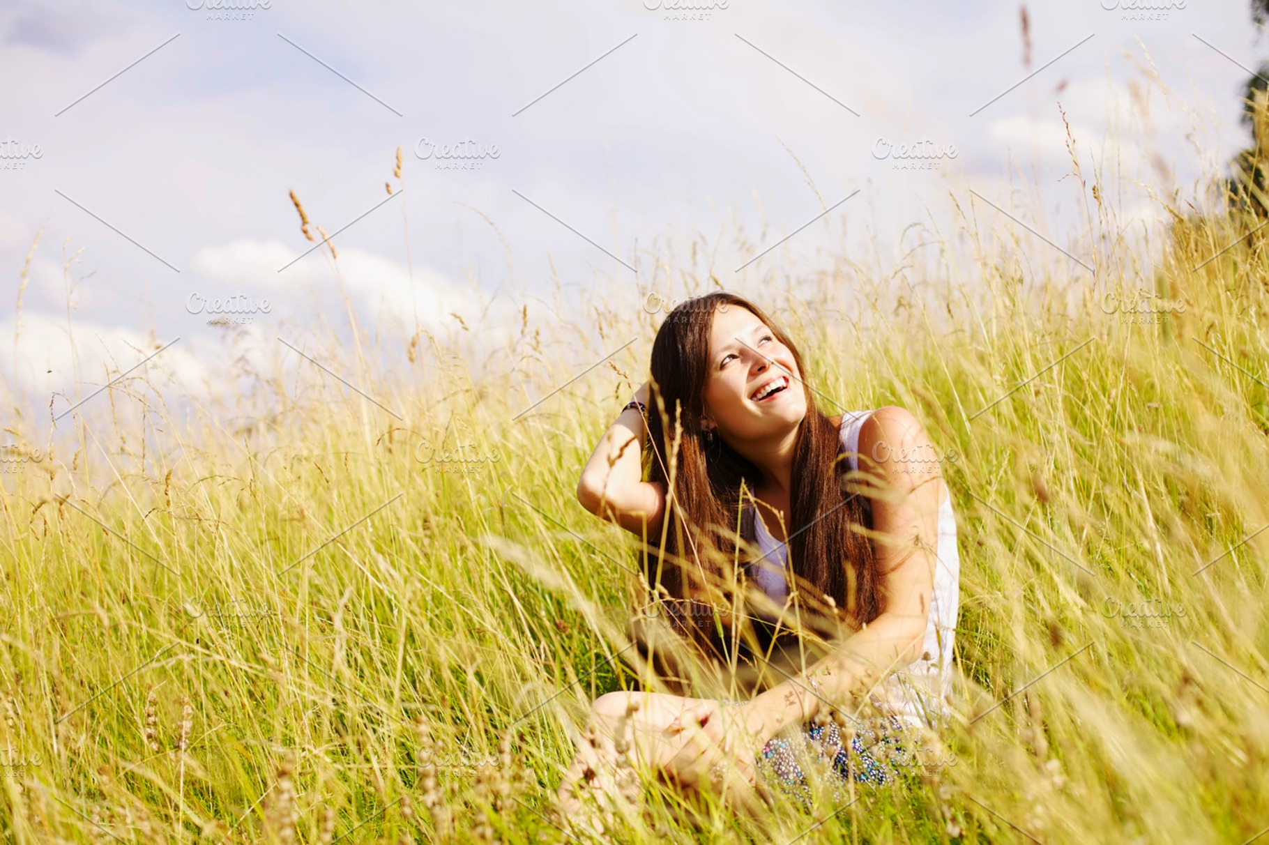 Smiling girl in summer park
