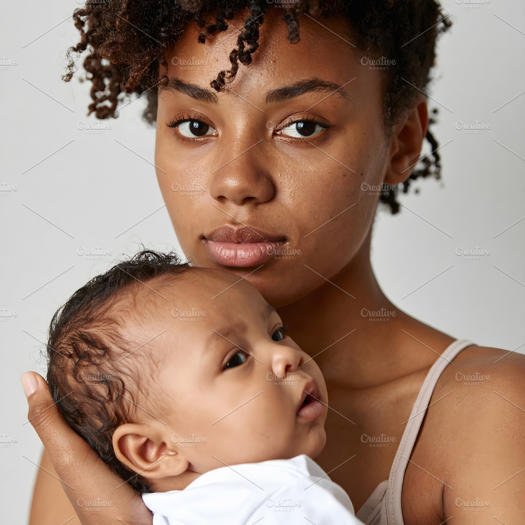 Woman with baby portrait showing protective embrace, a Person Photo by GoodGoods