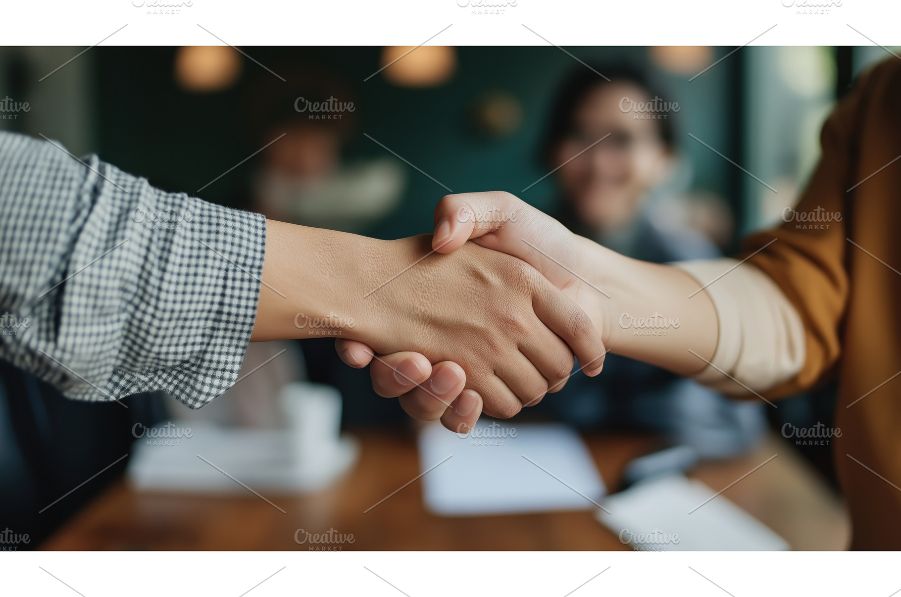Close-up of two people shaking hands, a Business Photo by Sergey Kotenev