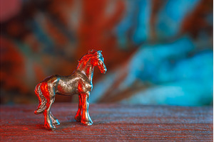 A metal horse figure with red tones, a Holiday Photo by Lukas Jonaitis SHOP