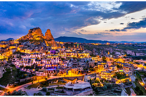 View of uchisar at sunset stock photo containing cappadocia and turkey, an Architecture Photo by Leonid Andronov