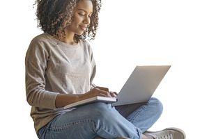 Student sitting with a laptop and notebook isolated photo, a Person Photo by DanFLCreativo