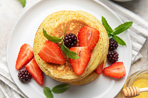 Pancakes with fresh strawberries blackberries honey mint, a Food & Drink Photo by Olena Rudo