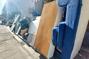 Pile of furniture and waste accumulating on suburban street after flood, an Architecture Photo by Antonio Gravante Market