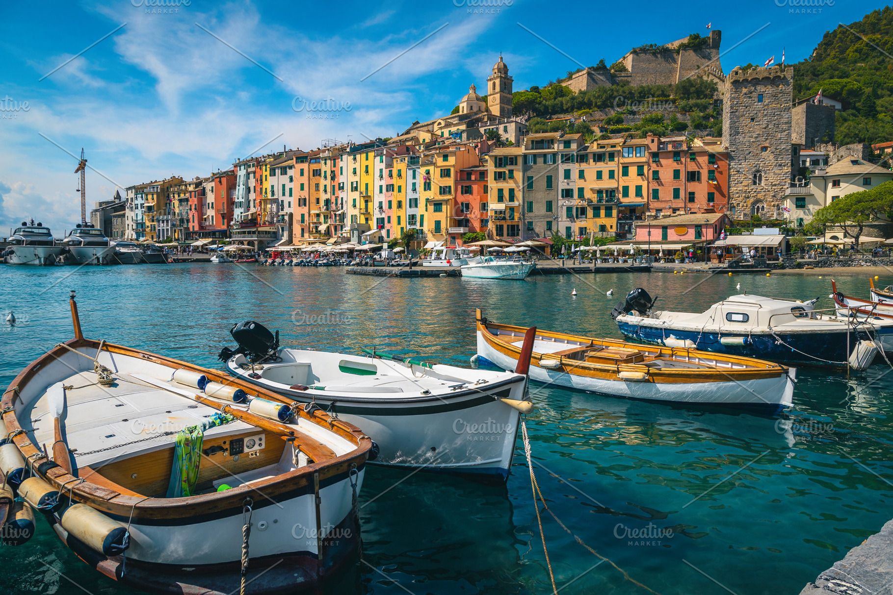 Colorful buildings and fishing boats, an Architecture Photo by Alpine Dreams