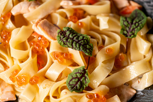 Noodle serving fish dish dining salmon red caviar, a Food & Drink Photo by Photo Drive Studio
