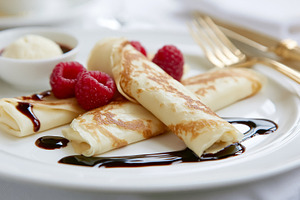 Dessert crepes creating a sweet and indulgent treat, perfect for breakfast, bru, a Photo by Studio ANNA