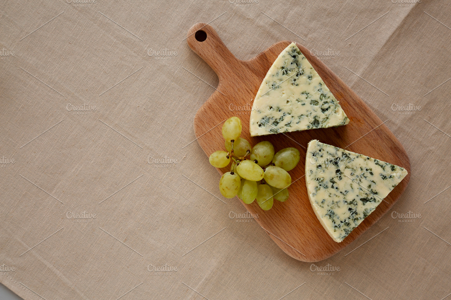 Delicious Cheese Danablu on a wooden board, top view. Copy space, a Food & Drink Photo by LiudmylaChuhunova