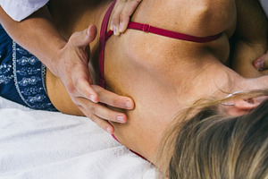 Physiotherapist examining a patient featuring physiotherapist, physiotherapy