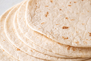 Stack of soft tortillas, a Food & Drink Photo by Alexander Prokopenko