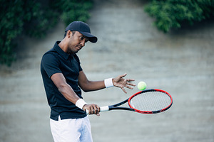 Tennis player returning the ball, a Sports & Recreation Photo by Artem Varnitsin