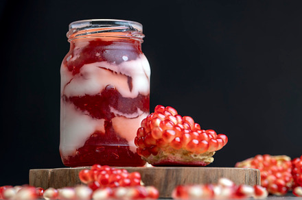 Fresh delicious milk yogurt with pomegranate flavor, a Background Photo by MyPhotos