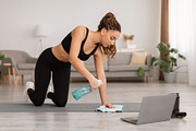 Black Female Cleaning Gymnastics Mat Using Detergent Before Workout Indoors, a Photo by Prostock-Studio (Thumbnail 1 of 2)