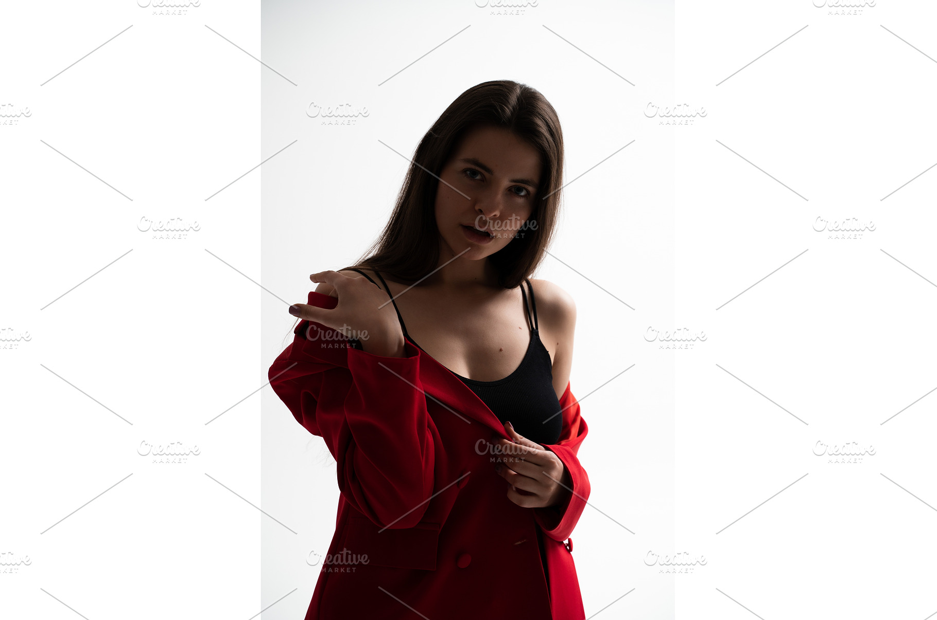Woman standing in a studio, modeling, a Person Photo by volodymyrshtun13795