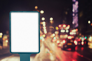 Billboard on city street at night, a Business Photo by BOOCYS