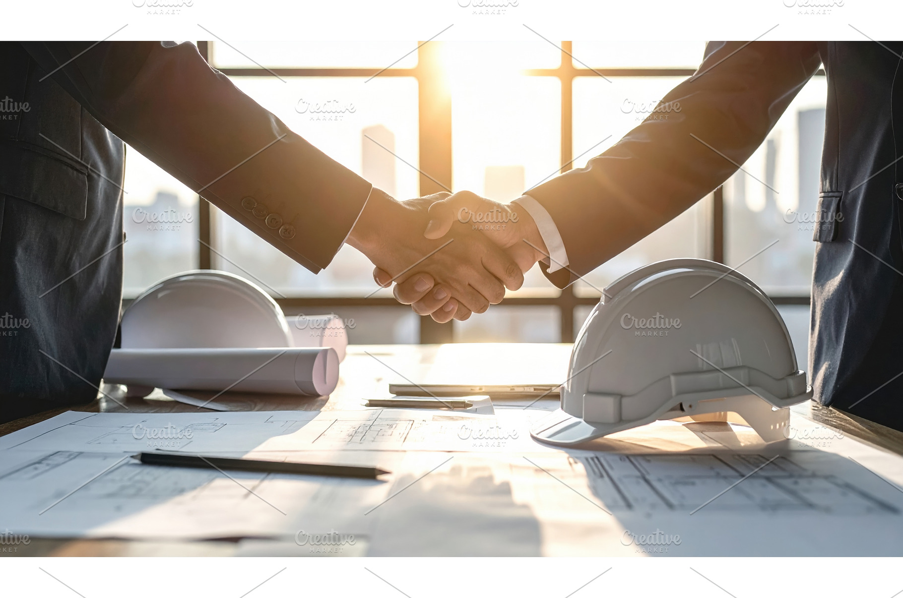Two business professionals shaking, a Business Photo by Igor Tichonow