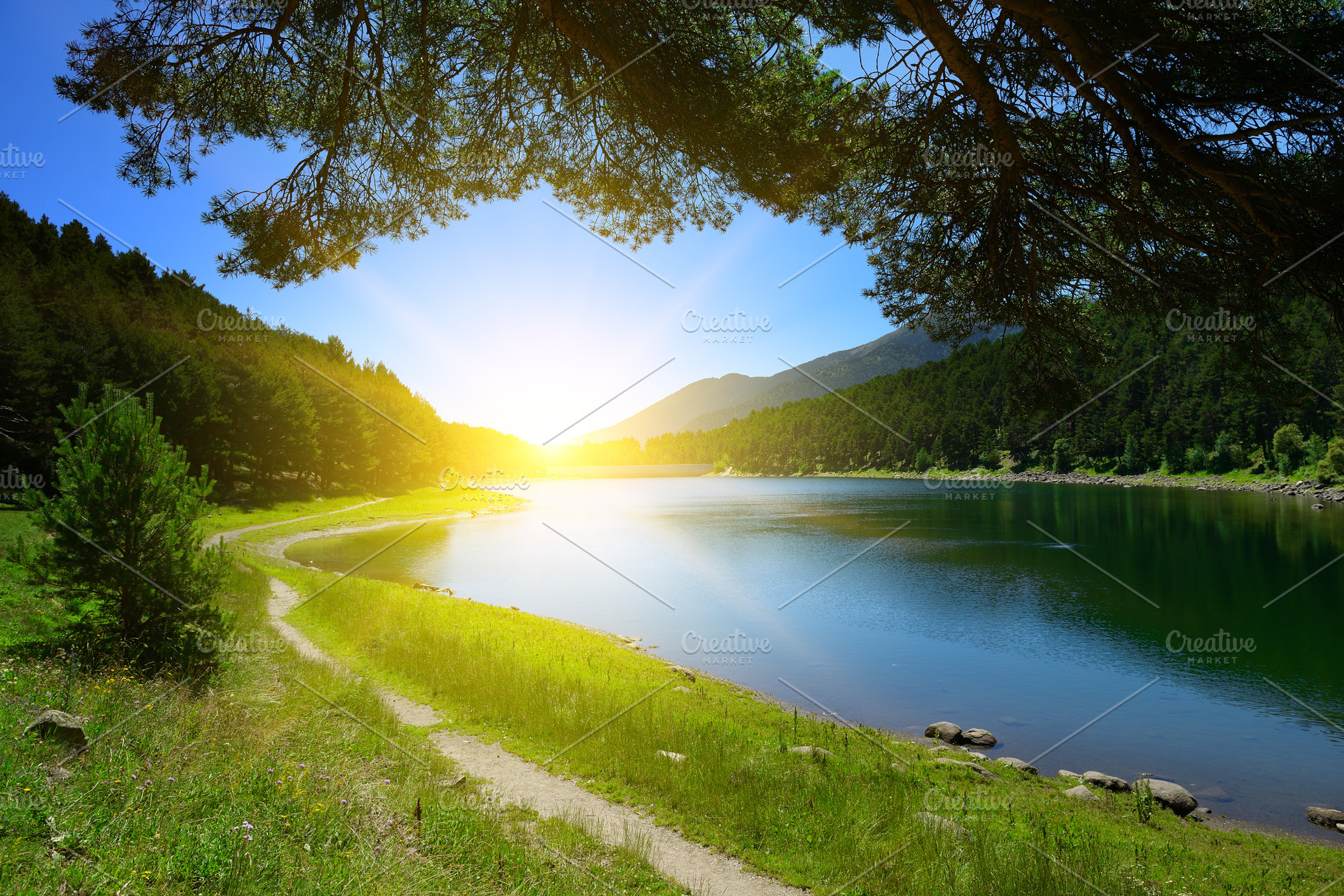 Beautiful sunrise over blue lake and mountains, a Nature Photo by Serg64