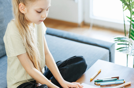 Child girl drawing with colorful pencils, an Arts & Entertainment Photo by Olena Rudo