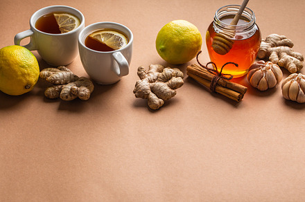 Natural cold, flu home remedies: hot tea cups with lemon, honey,, a Food & Drink Photo by its_al_dente