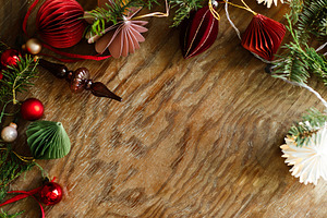 Christmas festive top border of paper garland, red baubles, orna, a Photo by Sonjachni