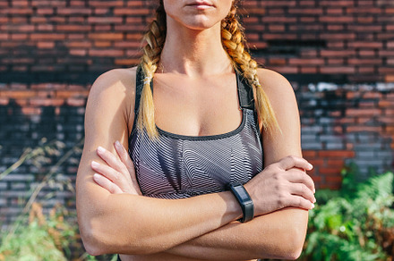 Sportswoman with crossed arms looking camera, a Person Photo by davidpereiras