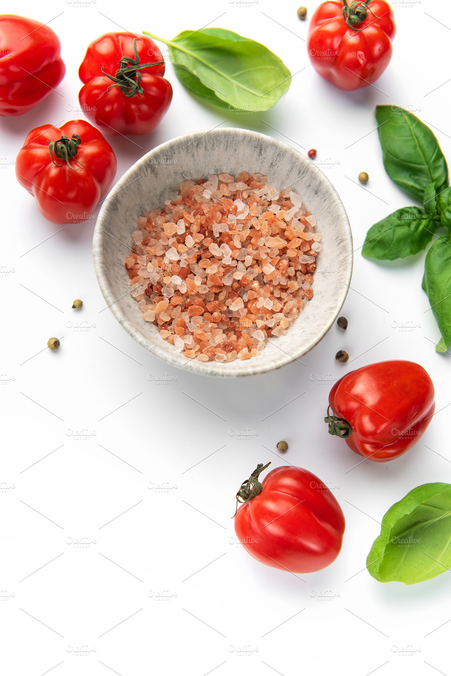 Pink himalayan salt in bowl with fresh tomatoes and basil, a Food & Drink Photo by Olena Rudo