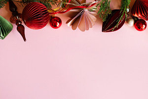 Stylish Christmas top border with paper ornaments, glass finial,, a Photo by Sonjachni