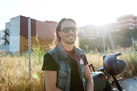 Young man wearing sunglasses on a chopper motorcycle, a Person Photo by 2Design