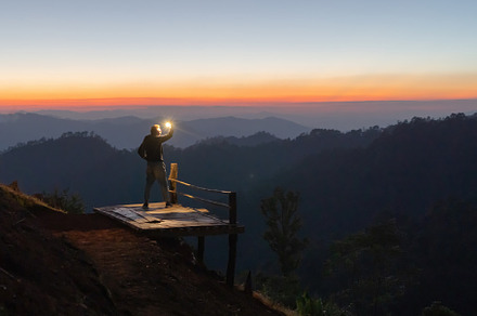 Portrait of a man, a tourist or backpacker, travel on green moun, a Photo by Tampatra