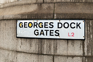 Georges Dock Gates street sign on a weathered stone building in