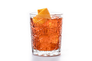 Americano cocktail garnished with twist orange isolated on white, a Food & Drink Photo by etorres69