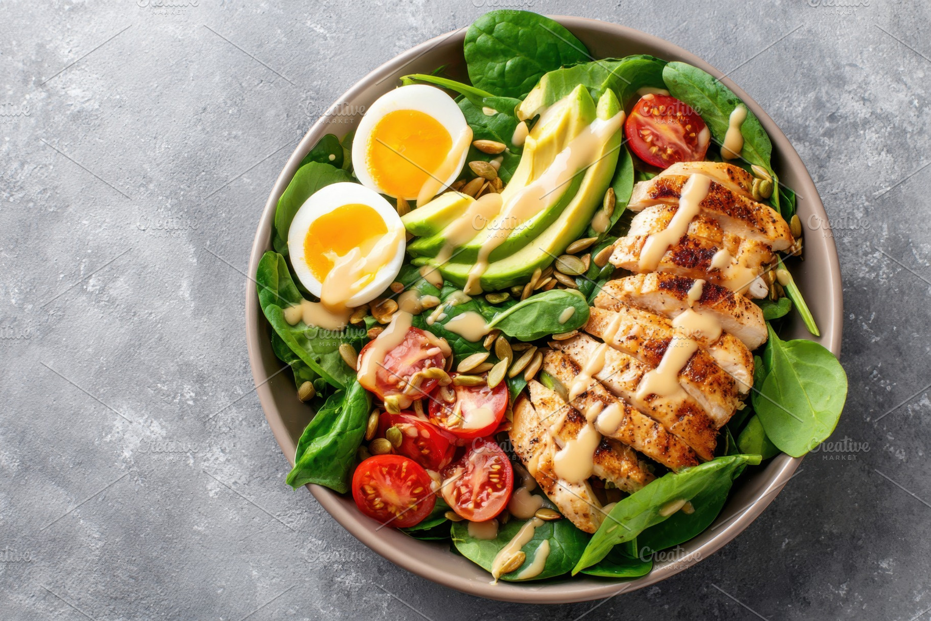 Healthy grilled chicken salad bowl with avocado and eggs, a Food & Drink Photo by AlyaAnd