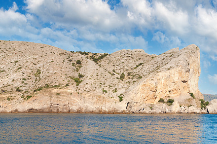 Summer rocky coastline and military base on rock top  (Alchak Ca, a Nature Photo by YuriyB