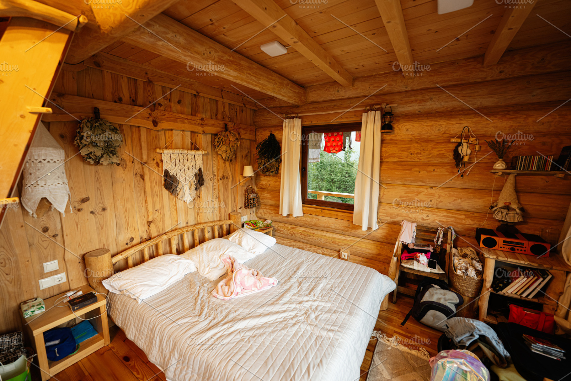 Cozy wooden bedroom with soft bedding and rustic decor,, a Photo by AS photostudio