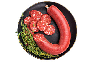 Whole and sliced Turkish sucuk (sujuk) with thyme on a black pla, a Photo by composter-box@mail.ru