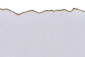 Torn edge of white blank sheet of paper with faded ends on isola, an Abstract Photo by ndanko