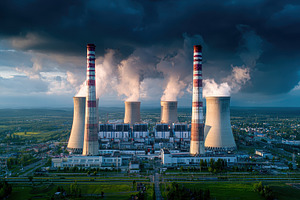 Aerial view of a power plant with ta, a Photo by Pixeness Studio
