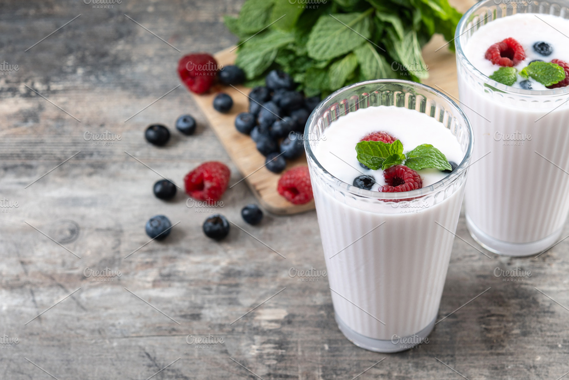 Fresh raspberry and blueberry smoothie isolated on white background, a Food & Drink Photo by etorres69