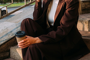Outdoor contemplation coffee break pensive woman, a Person Photo by Photo Drive Studio