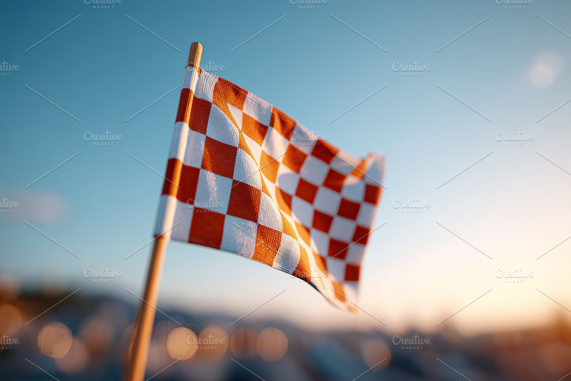 Checkered race flag waving proudly on a wooden pole during sunset at a motorspo, an Arts & Entertainment Photo by AlyaAnd